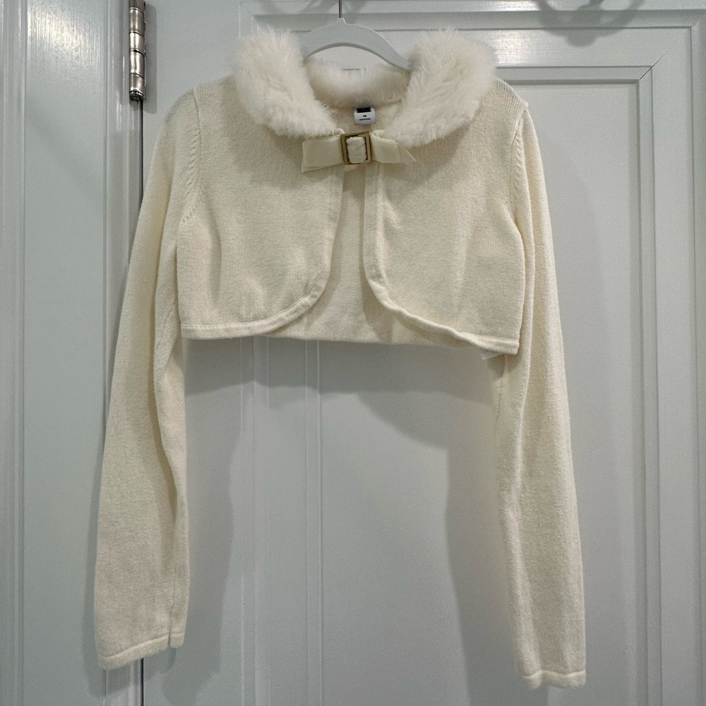 Adorable cream shrug with a fur collar from Janie and Jack!